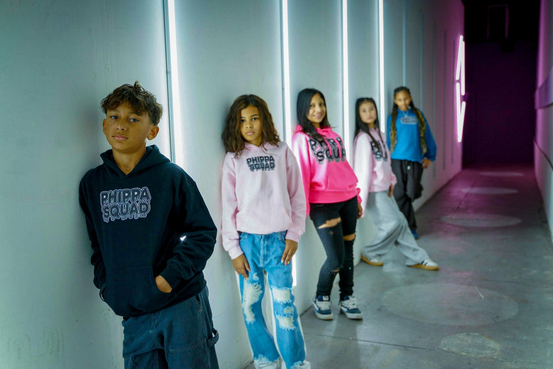  Phippa Squad crew in colorful hoodies, five young members in a neon-lit corridor